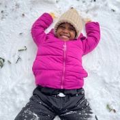 Student making a snow angel. 