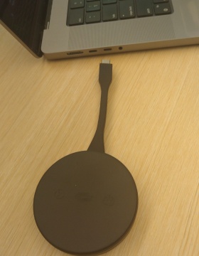 Zoom image: Connecting the puck adapter to a USB-C port. 