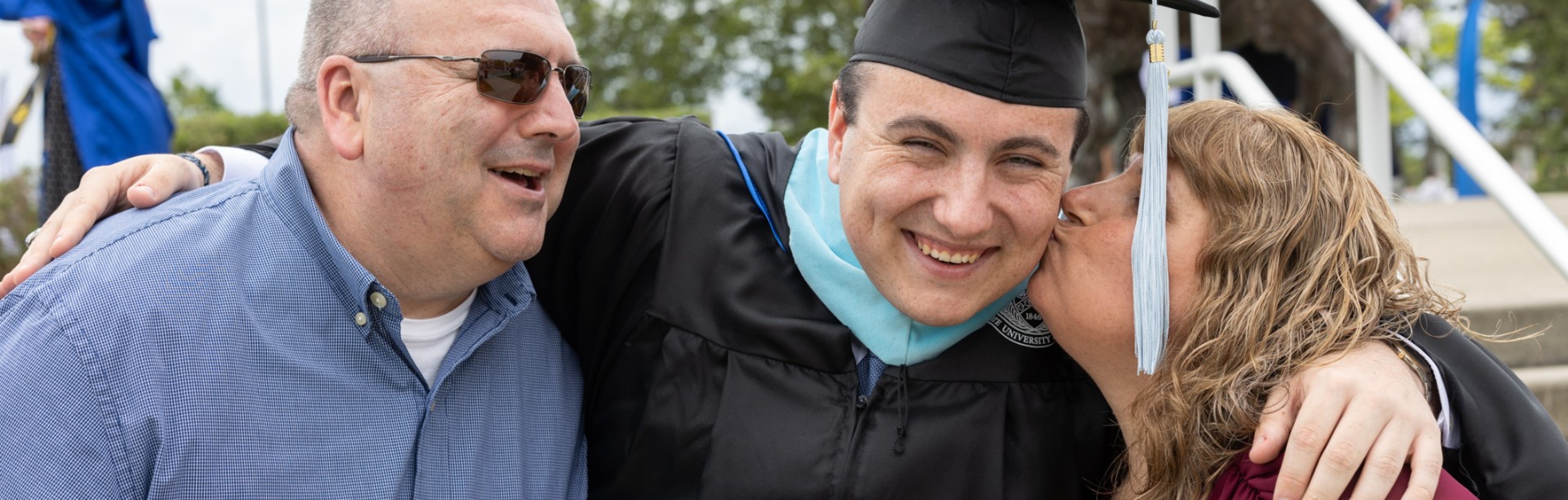 Image of students in caps and gowns. 