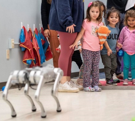 An AI robot working with children in the Early Childhood Research Center. 