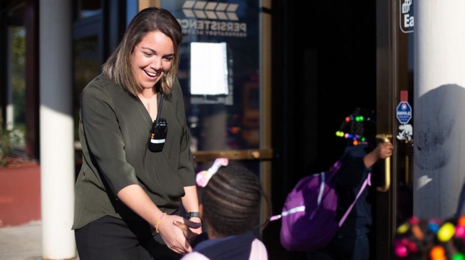 Joelle Formato greets a student at the Persistence Preparatory Academy she founded on Buffalo’s East Side, August 2019. (Photo courtesy Joelle Formato). 