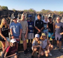 Zoom image: Martin, right, with students on a school trip to Victoria Falls, Livingstone, Zambia, September 2018. (Photo courtesy Rob Martin) 