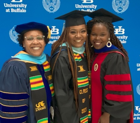 Zoom image: Erika McDowell, clinical associate professor of educational leadership and policy, Candace Dowdell, LIFTS student, and Gwendolyn Baxley, assistant professor of educational leadership and policy, celebrate together at GSE's 2023 Commencement Ceremony. 