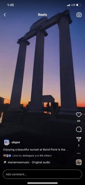 A screen shot of a Reel with the UB pillars and the sunset. 