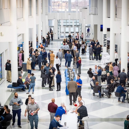 Zoom image: Safe Schools attendees in the UB Center for the Arts atrium.