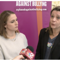 Zoom image: UB Alberti Center's Brie Kishel being interviewed by WGRZ Channel 2 News at BAND Against Bullying event.