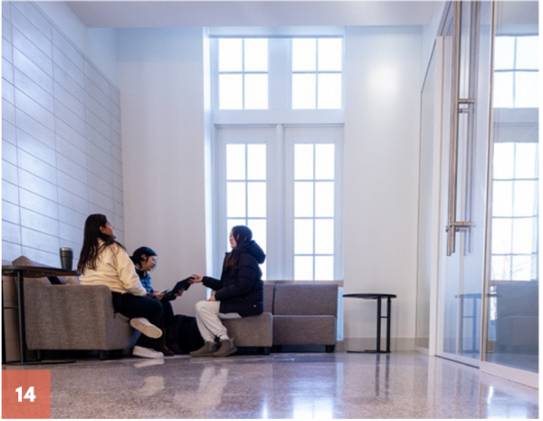 Zoom image: 14. Between classes, students sit in the light-filled lounge on the first floor of Foster Hall in January 2026. 