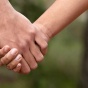 Holding hands. 