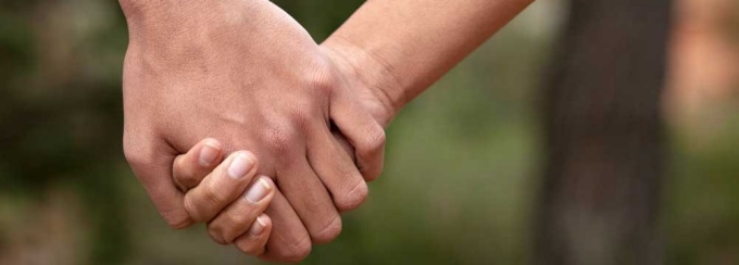 Holding hands. 