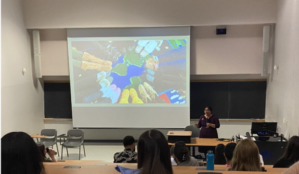 Zoom image: Susan C. Faircloth gives the keynote speech at GSE Student Research Symposium. 