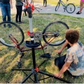 Youth bicyclist fixing a bicycle. 