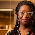 Portrait of Africa Hands, a new professor in the Graduate School of Education, photographed in Silverman Library in October 2022. Photographer: Meredith Forrest Kulwicki. 