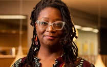 Portrait of Africa Hands, a new professor in the Graduate School of Education, photographed in Silverman Library in October 2022. Photographer: Meredith Forrest Kulwicki. 