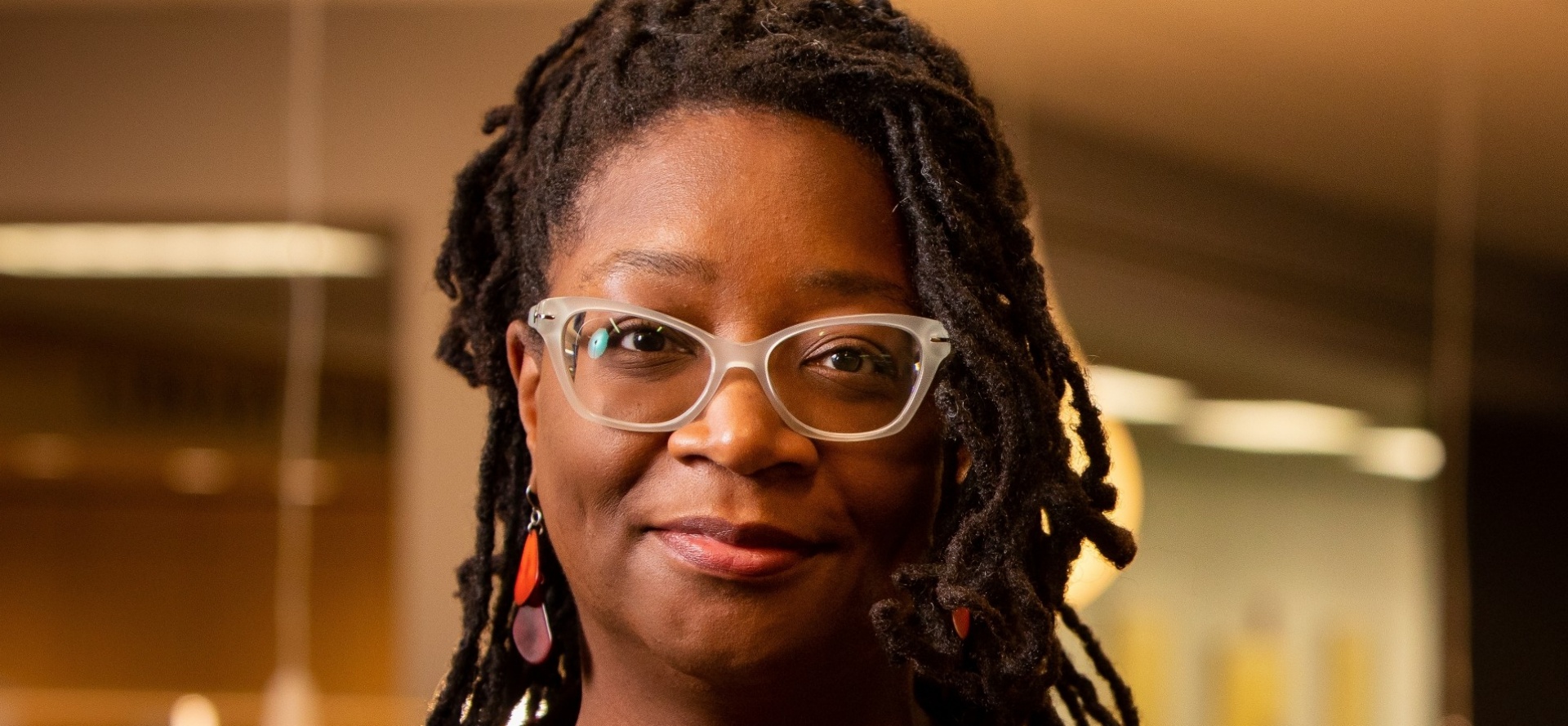 Portrait of Africa Hands, a new professor in the Graduate School of Education, photographed in Silverman Library in October 2022. Photographer: Meredith Forrest Kulwicki. 