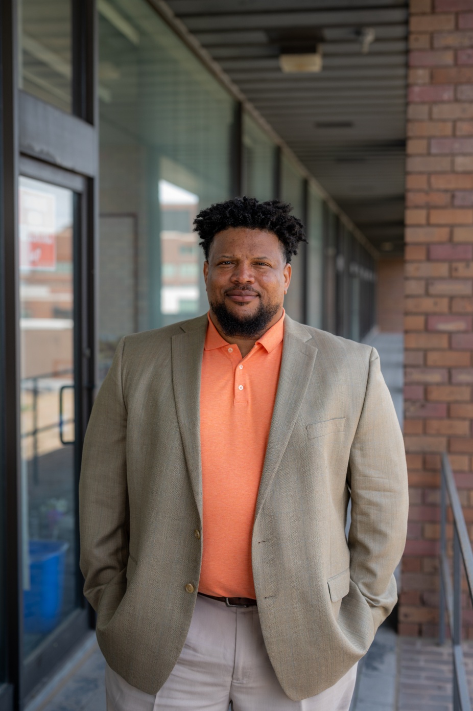 Program lead Wil Green stands outside on UB's North Campus. Photo by Onion Studio. 