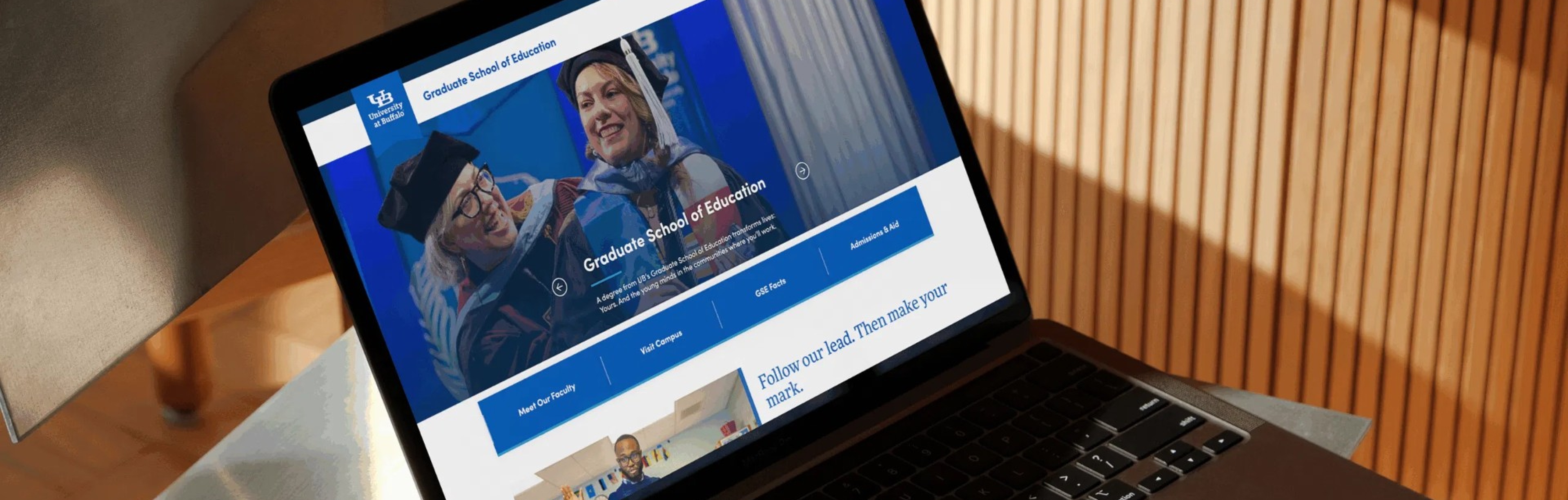 A laptop displaying the GSE website.