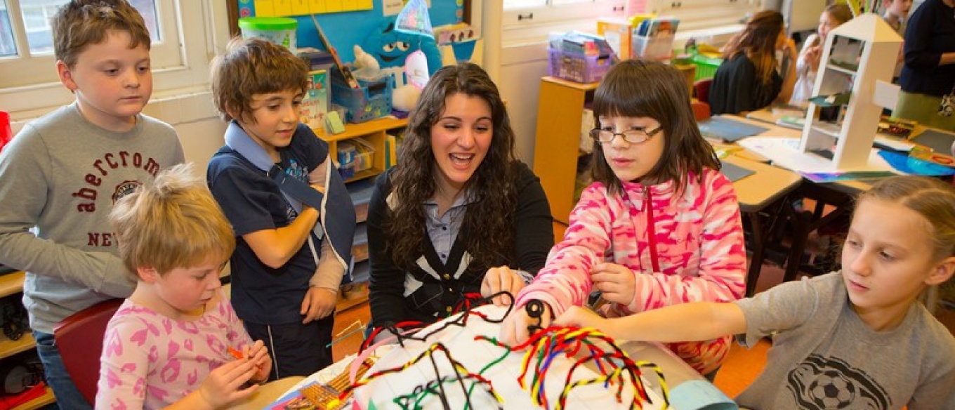 Teacher in a classroom with students. 