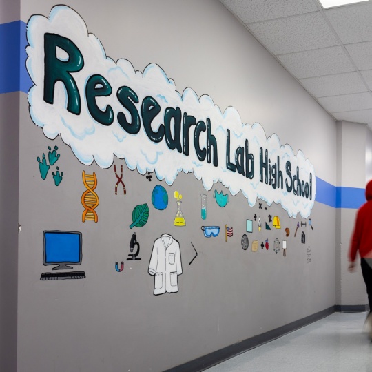Students walking in a hallway. 