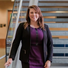 GSE alumna Amanda Knapp, PhD, poses on campus at the University of Maryland, Baltimore County, where she is an associate vice provost and assistant dean for the Division of Undergraduate Academic Affairs, in Baltimore, 2019. (Photo/Marlayna Demond). 