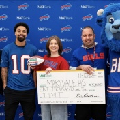From left to right: M&T's Senior Executive Vice President, Eric Feldstein, Buffalo Bills wide-receiver Khalil Shakir, Breanna Pelonero, EdM '22 and Maryvale's principal Jon Lattanzio alongside Bill's mascot Billy Buffalo. 