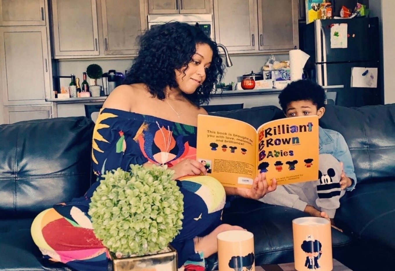 GSE alumna, school psychologist and mother Desiree Williams, MA/AC &rsquo;15, with her son Cortland, 4, and &ldquo;Brilliant Brown Babies,&rdquo; the book she wrote, illustrated and published to inspire children and their parents. (Photo courtesy Desiree Williams). 