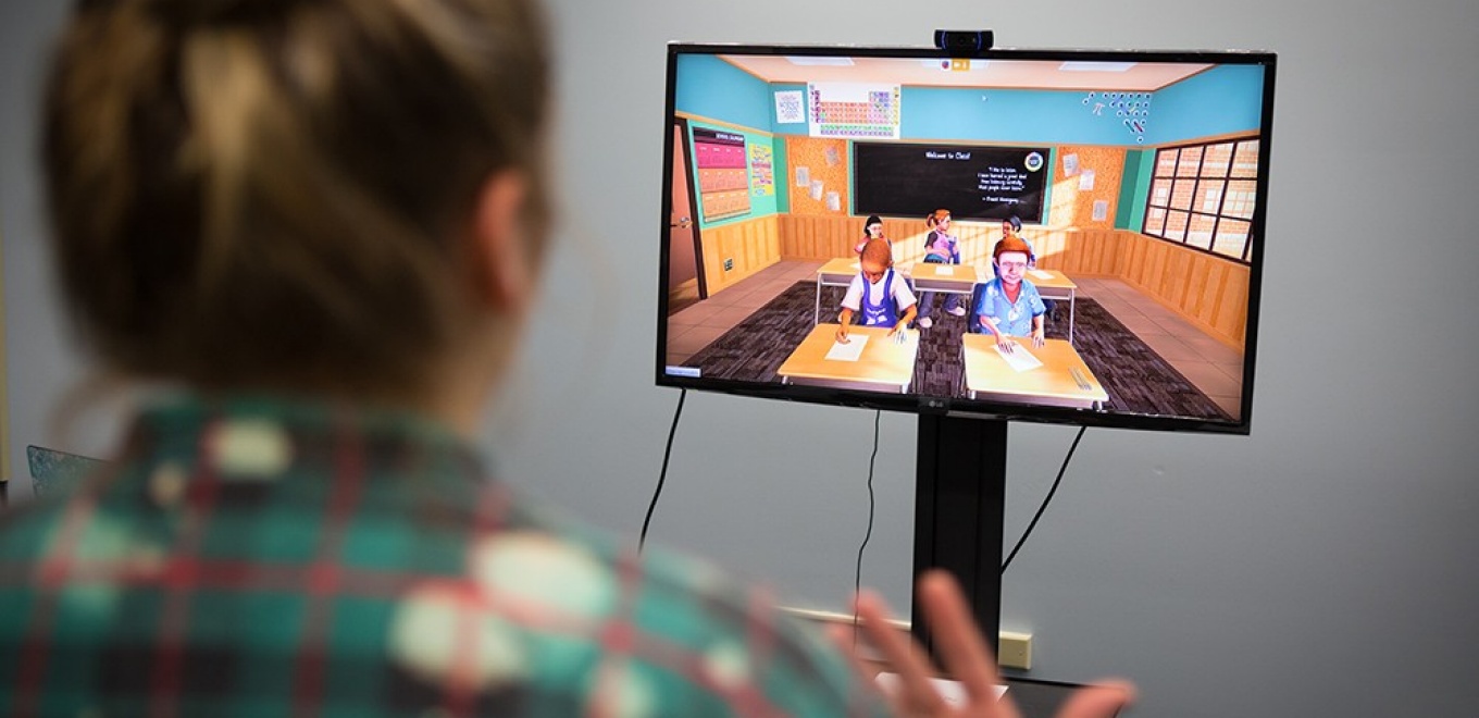 Student utilizing TeachLiVe teaching simulator.