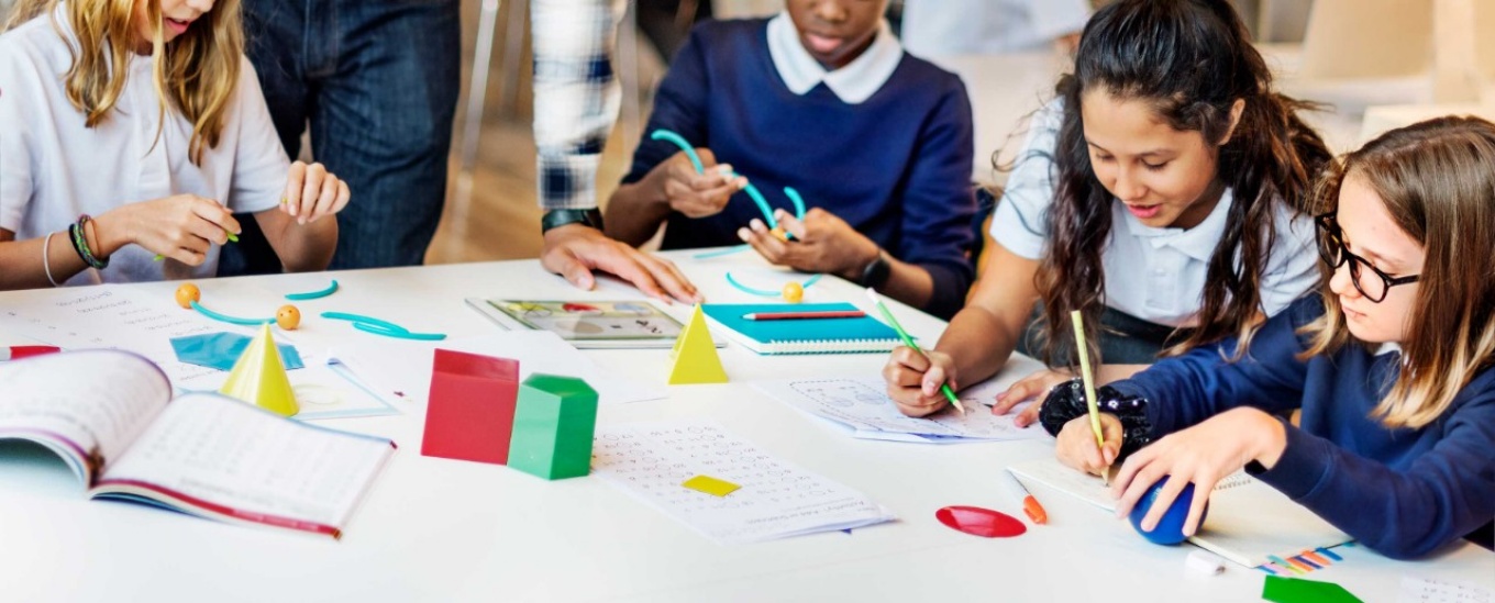 Students in a classroom taking a lesson in math. 
