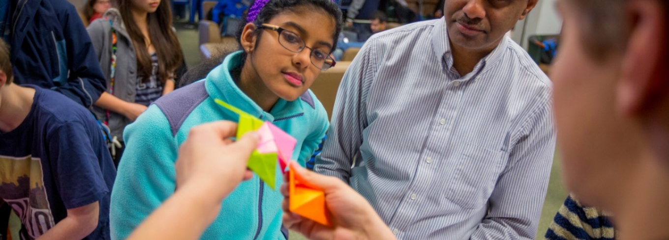 Young preschool aged child in a classroom coloring.