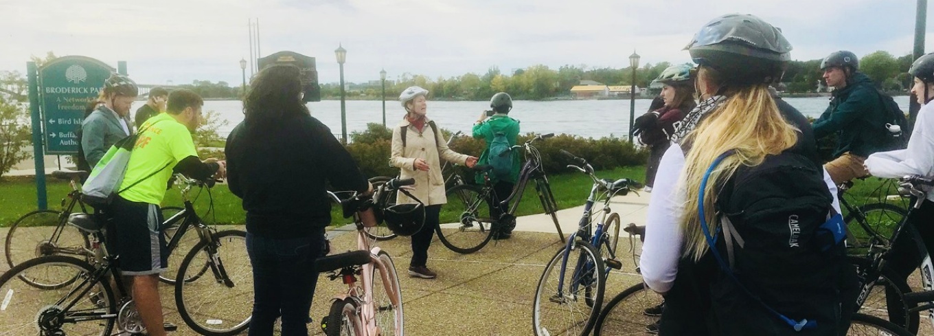 Class of students biking through Buffalo. 