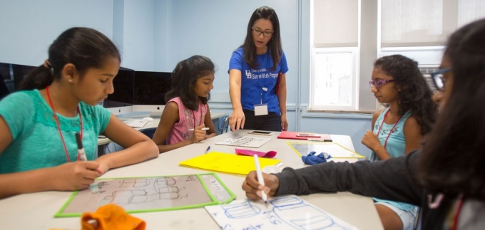 Professor Ji-Won Son teaches female students as part of the Summer Math Program. 