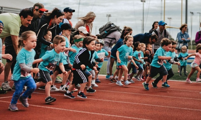 Children lined up at the starting line to run a race at the ECRC Fun Run 2019. 
