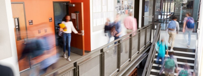 Students moving in the hallways of a school. 