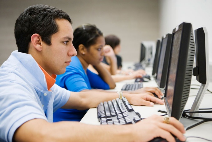 Students taking test in a computer lab. 