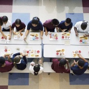 Children eating lunch in a school cafeteria. 