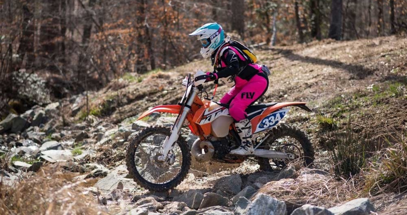 GSE alumna Amanda Knapp, PhD, hones her off-road, hare-scramble race technique in a women's ride clinic at Budds Creek Motocross Park in Mechanicsville, Md., 2019. (Photo/Samantha Kilgore).