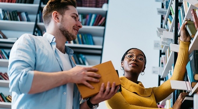 Librarians in book stacks. 