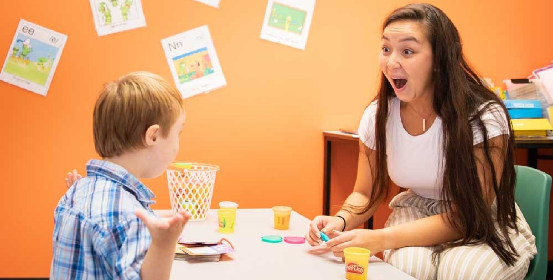 UB student working with a GiGi's Playhouse student in class. 