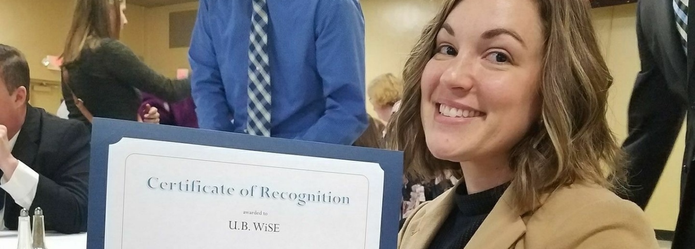Danielle Lews is recognized at a UB Wise event. 