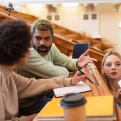Students in a college classroom in discussion. 
