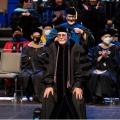 Image of Paul McCaffee being hooded at commencement. 