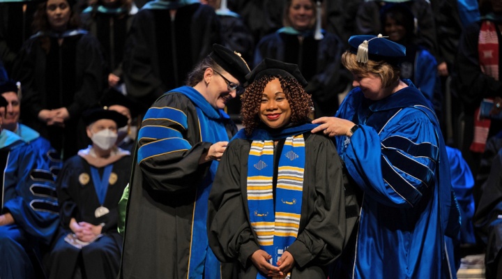 Doctoral candidate being hooded at the UB GSE 2022 commencement ceremony. 