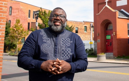LaGarrett King standing in the African American Corridor in Buffalo, NY. 