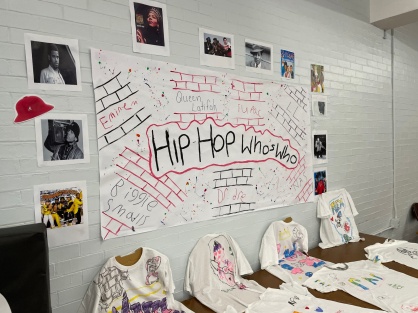Zoom image: Student-made tee-shirts and classroom wall dedicated to the &quot;who's who&quot; of rap. 