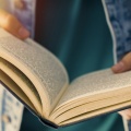 Young man holding a book. 