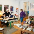 Corrie Stone-Johnson (center) speaks with two of her regular customers. 