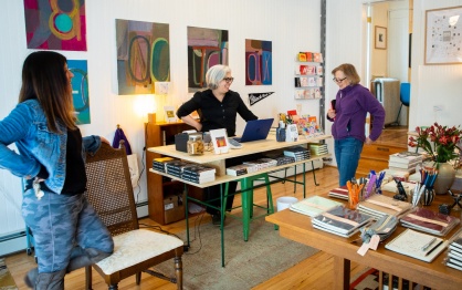 Corrie Stone-Johnson (center) speaks with two of her regular customers. 