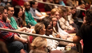 Zoom image: The GSE community comes together in the Center for the Arts theater for learning and dialogue. 