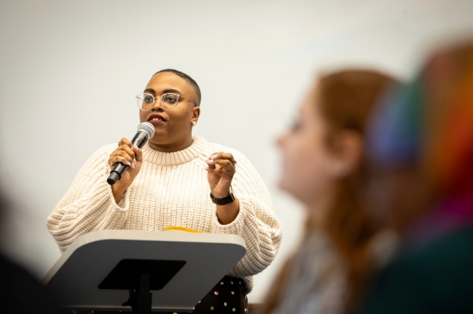 Zoom image: Dawnavyn James speaks to her audience about her own experience learning about and teaching Black history.