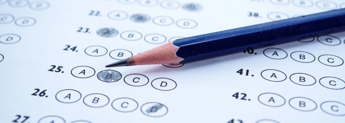 Standardized test bubbles with a pencil.