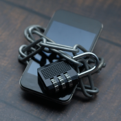 Cellphone locked by bike lock. 